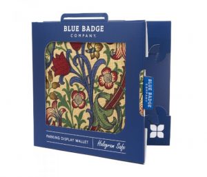 Image is a photograph of a William Morris-inspired blue badge protector in packaging, against a white background