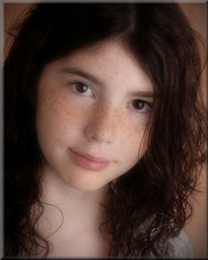 Image of Cassidy Megan - Puple Day founder - young girl with freckles and dark wavy hair