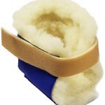 Image shows a photograph of a royal blue bootie lined with cream-coloured faux fur