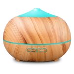 Image shows a spherical, veneered air humidifier with turquoise detail and timer on the front