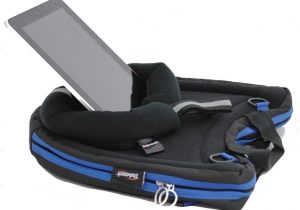 Image shows an iPad being held upright with a Media Mount, attached to the tray surface of a Trabasack Curve Connect with blue trim